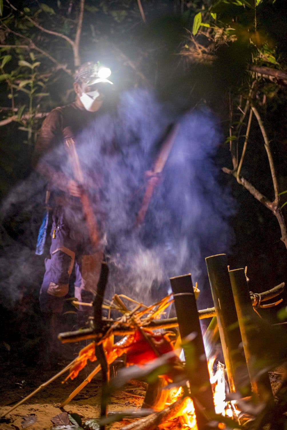 Cooking food over a campfire