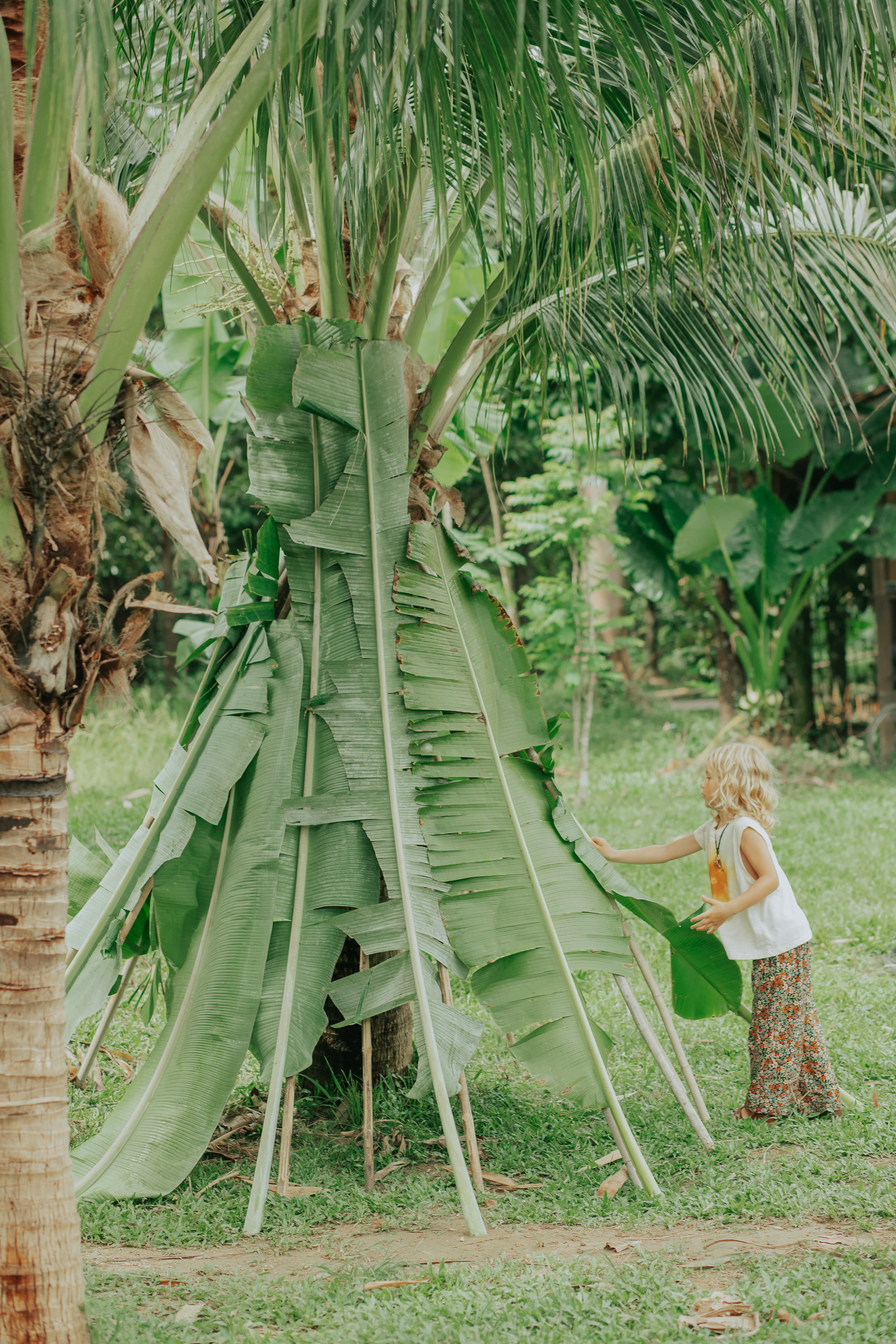 Kids making bamboo instruments
