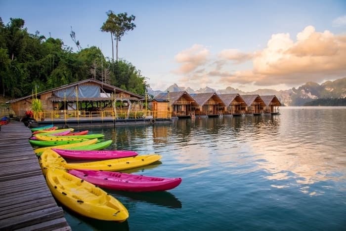 Bamboo raft houses on the lake at sunset