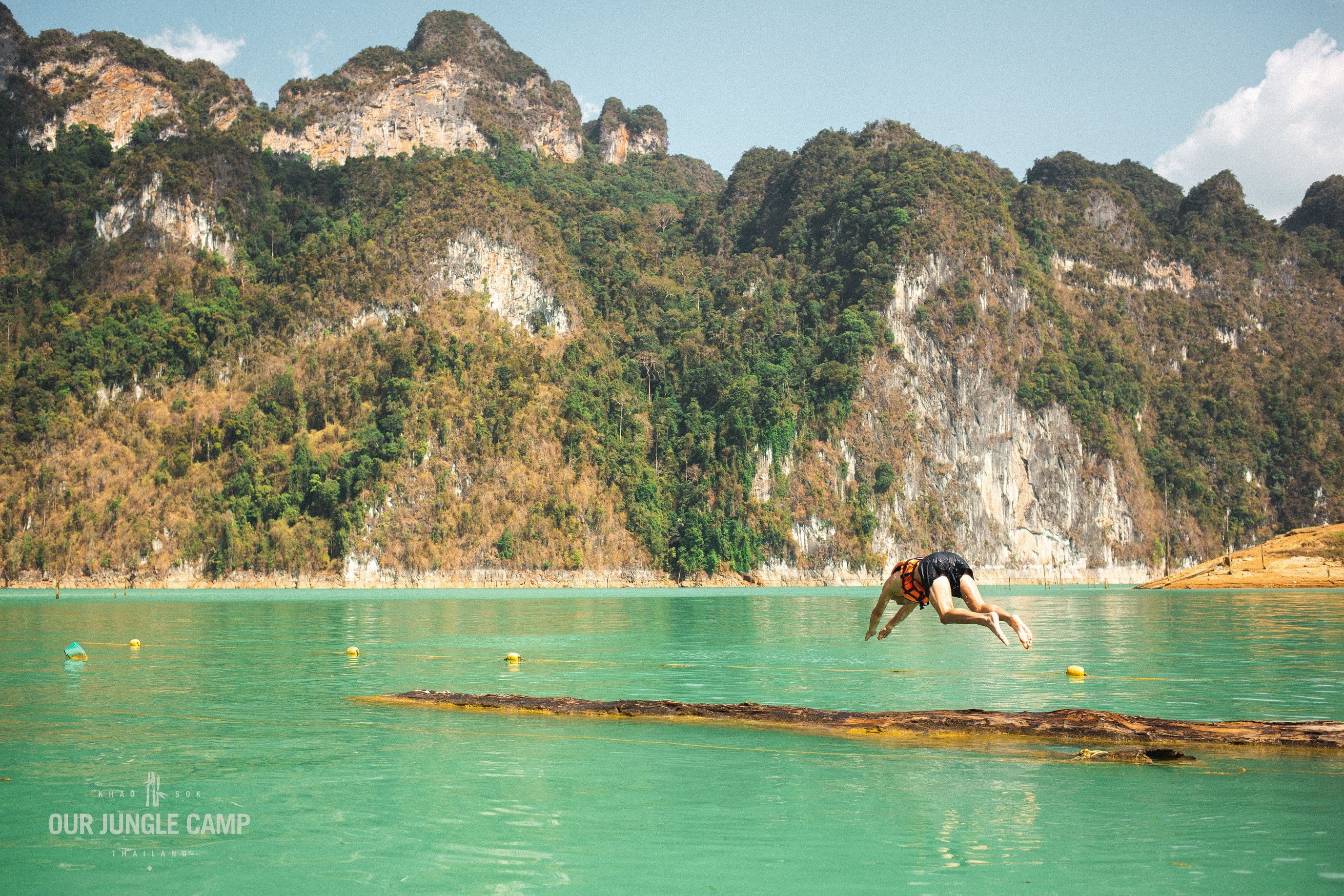Jumping off bamboo pier into Cheow Larn lake