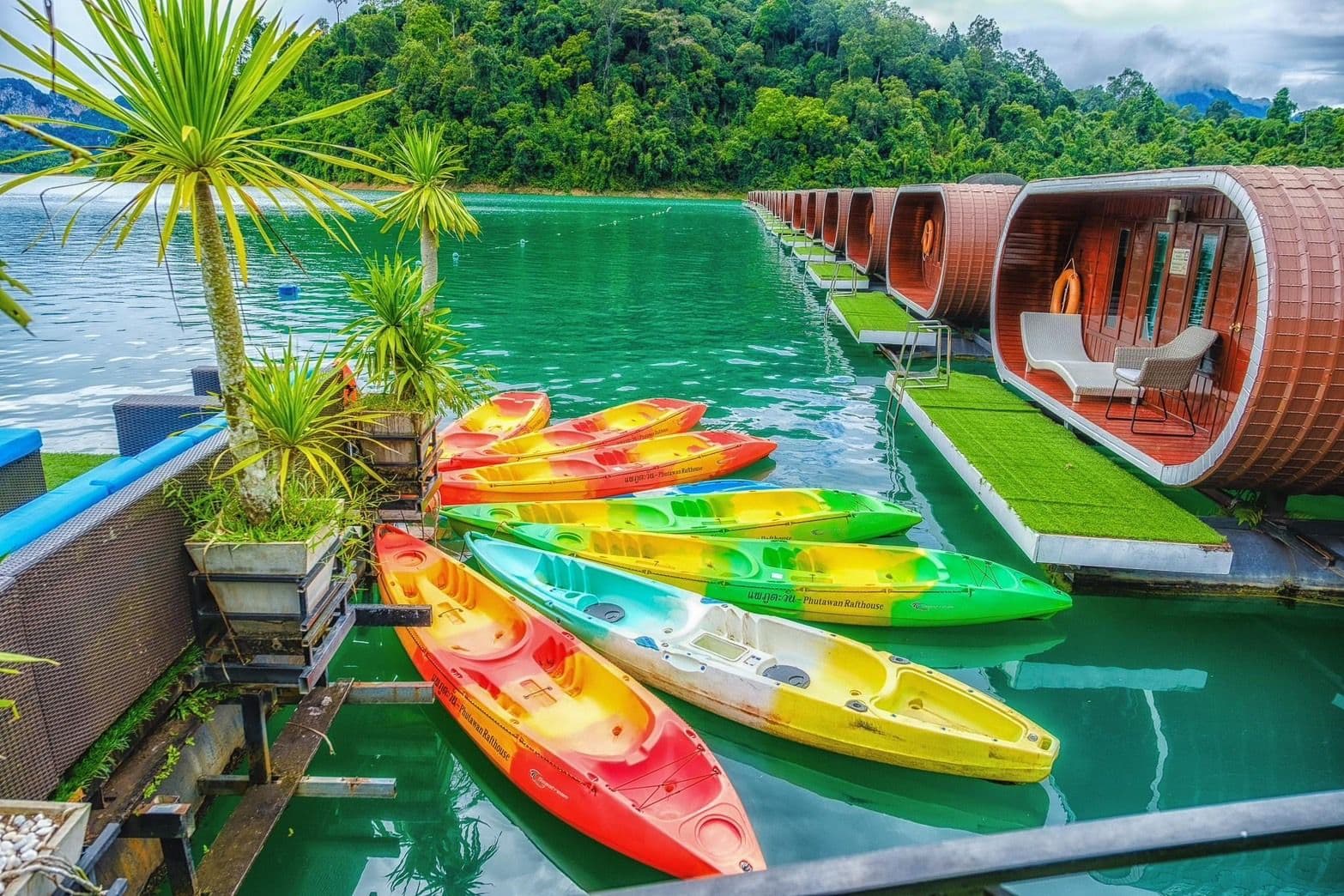 Kayaks tied to pier on Cheow Larn lake