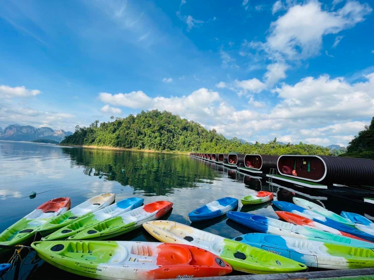 Kayaks tied to pier on Cheow Larn lake