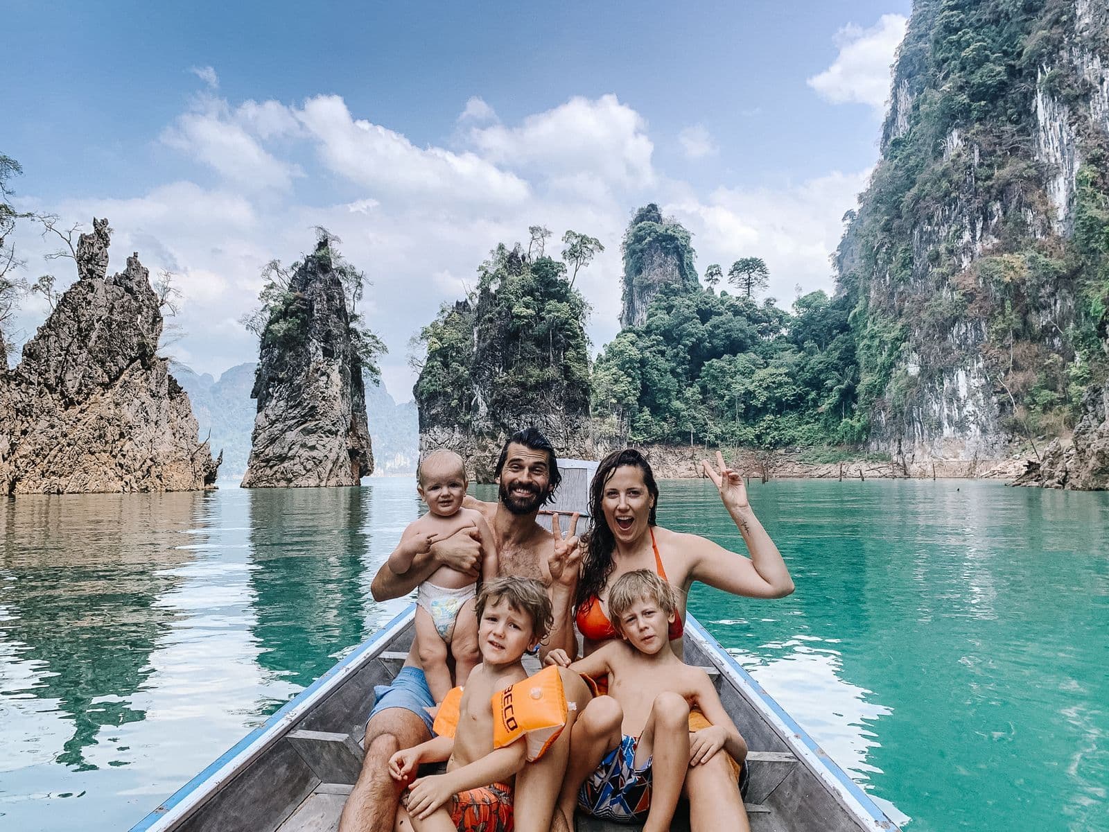Family on boat tour on Cheow Lan Lake