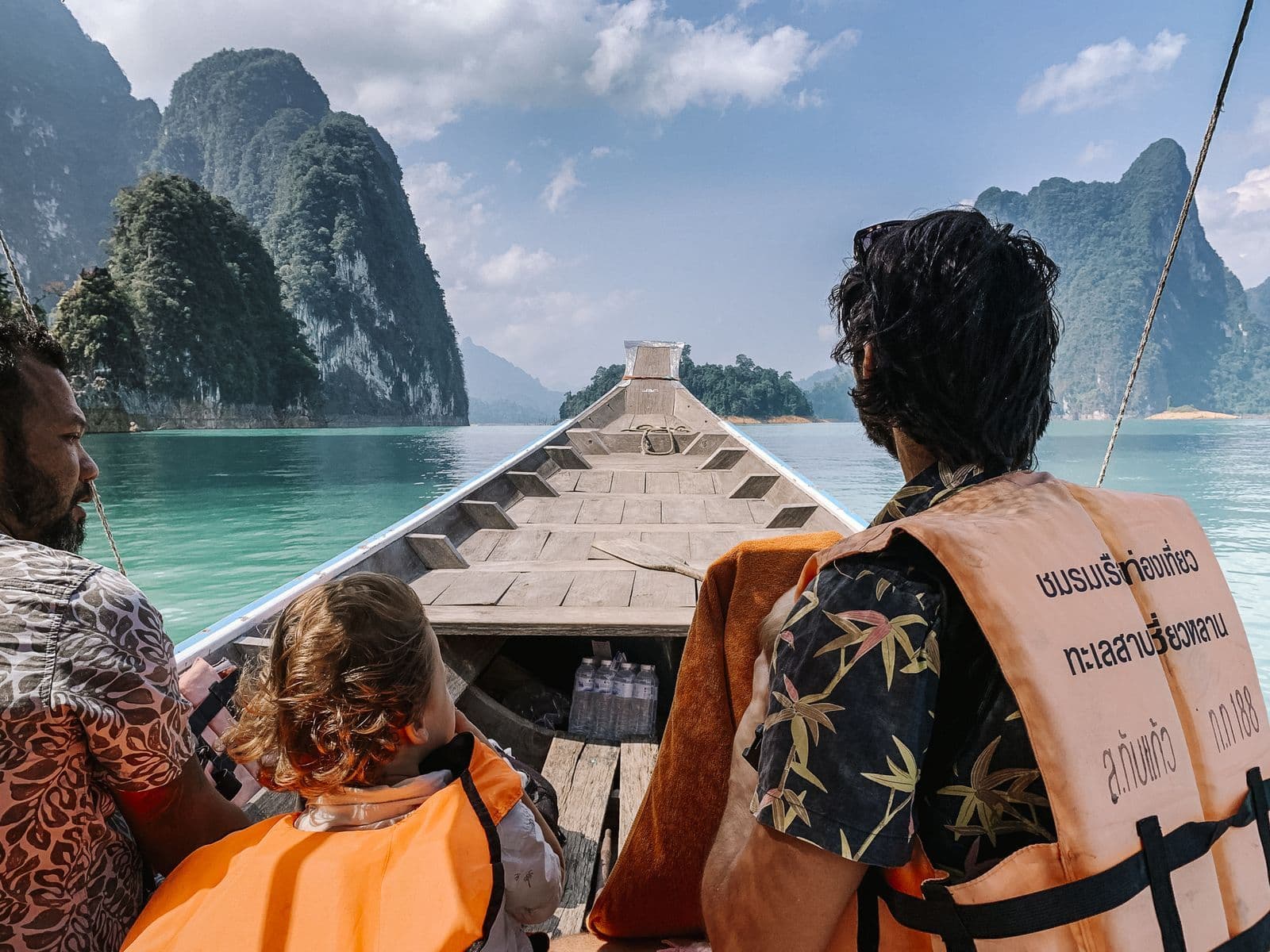 Family on boat tour on Cheow Lan Lake