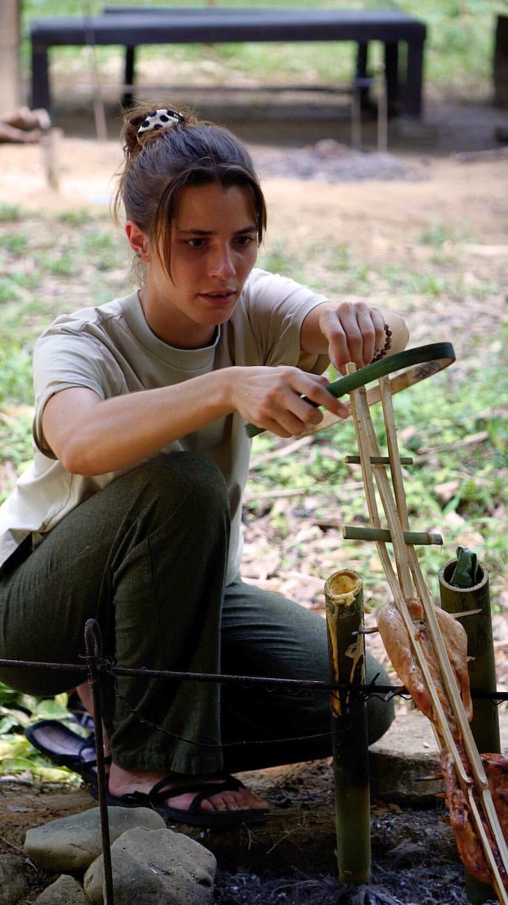 Preparing a bamboo for jungle cooking