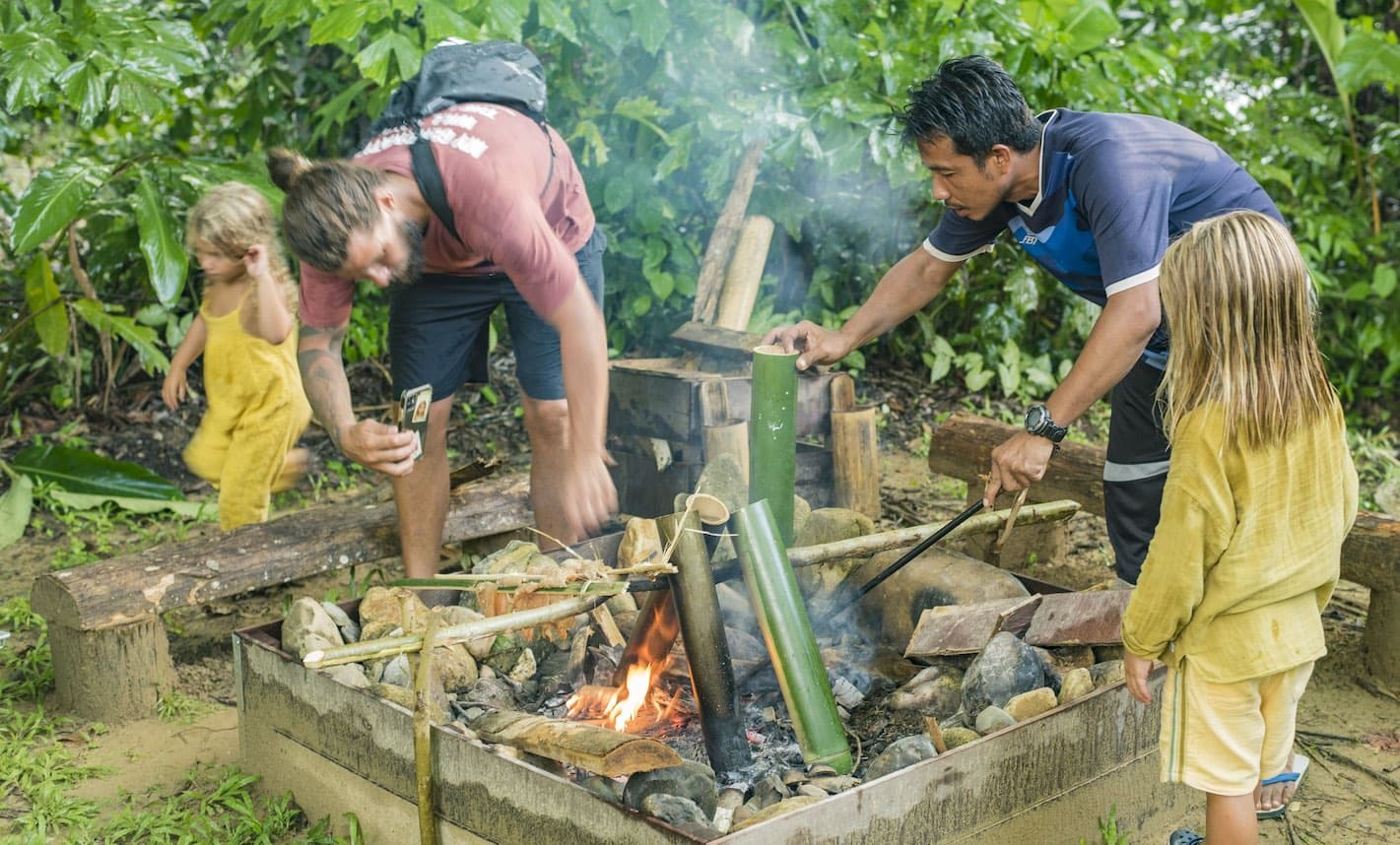 Preparing a bamboo campfire for dinner