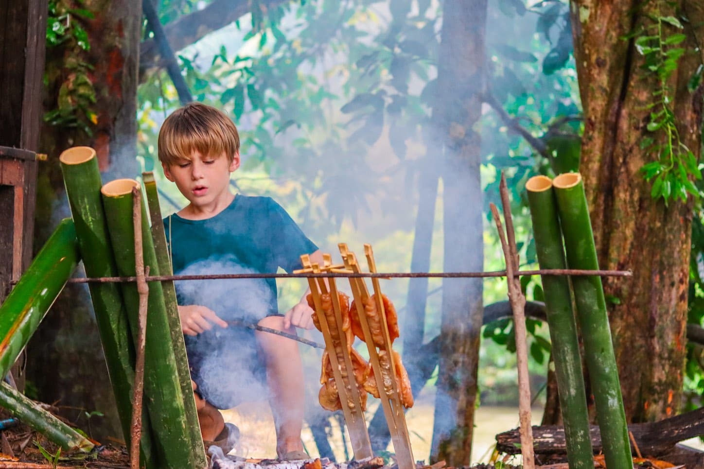 Bamboo cooking over the fire