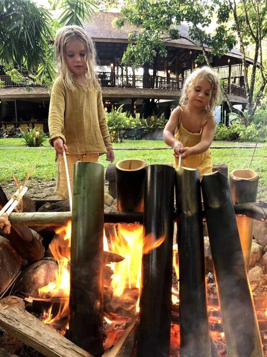 Cookng rice in bamboo over a camp fire